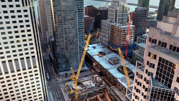 View looking down on construction of multiple buildings in San Francisco's Transbay Transit Center District