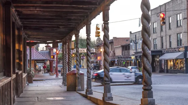 View down covered sidewalk in historic Stockyards district in Fort Worth, Texas