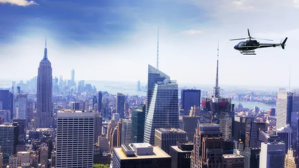 Helicopter flying over New York City with Empire State Building visible on left