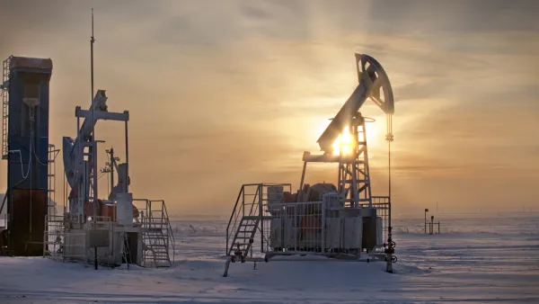 Oil extraction pumps in winter landscape in Russia