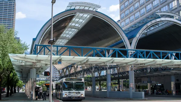 Downtown Houston covered bus station with one parked bus