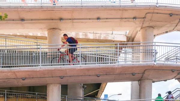 Bike rider on multi-tiered Philadelphia bridge